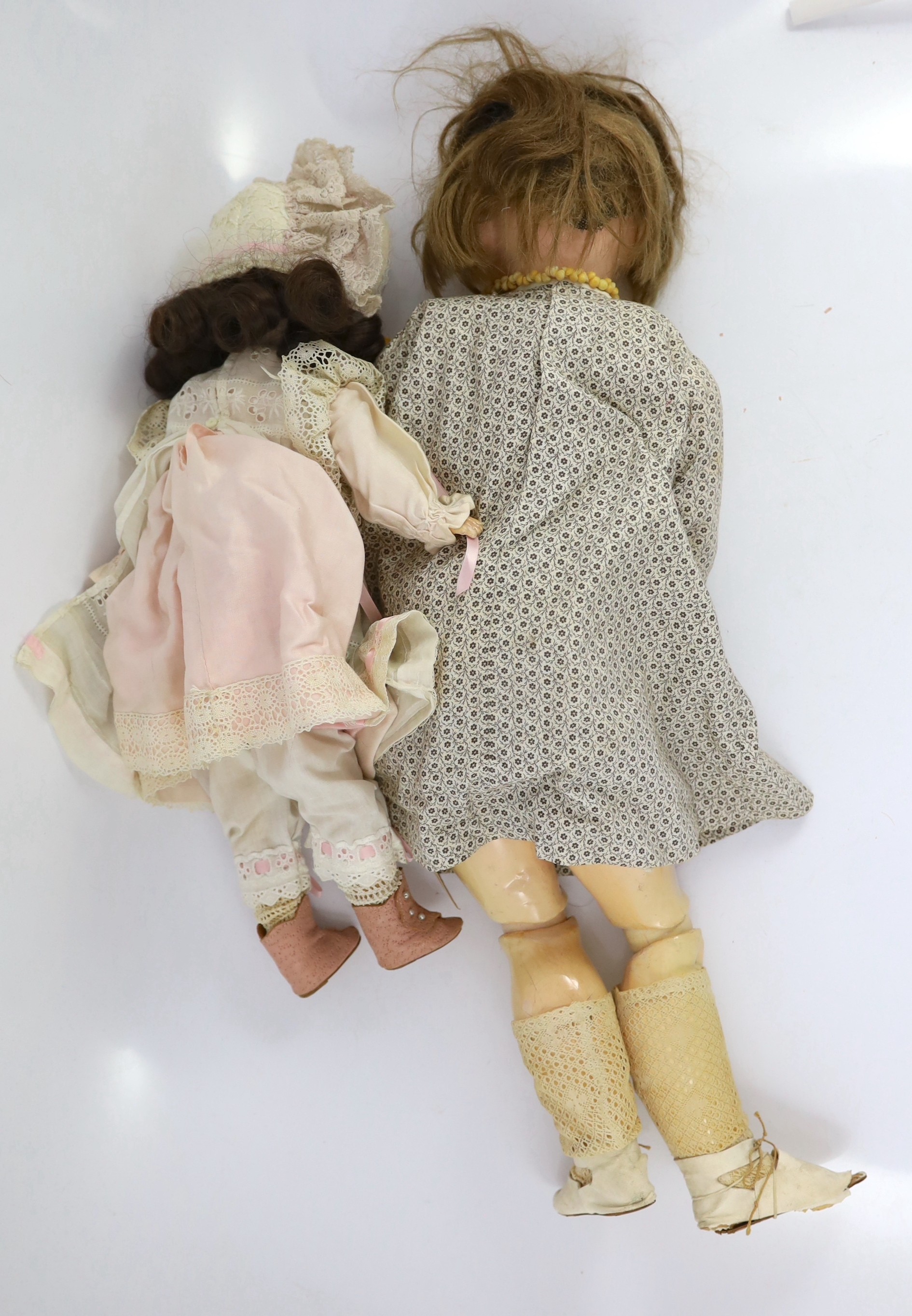 An unusual composition headed doll, German, circa 1900, 19in. (2)